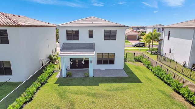 back of property featuring a lawn and a patio area