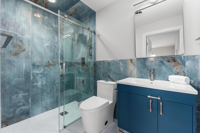 full bath featuring a sink, tile walls, toilet, and visible vents