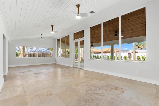 empty room featuring wooden ceiling, baseboards, vaulted ceiling, and a ceiling fan