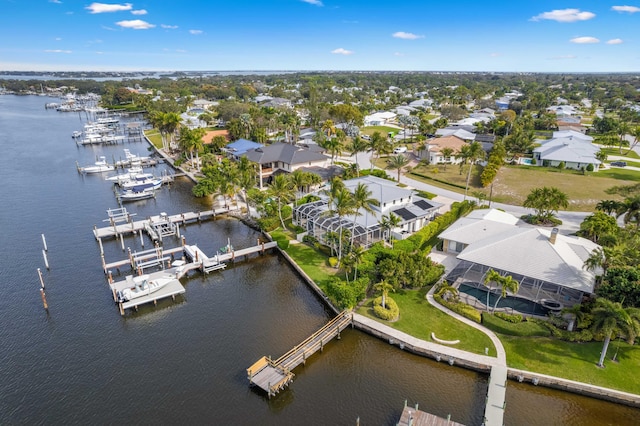 birds eye view of property featuring a water view and a residential view