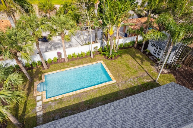 view of pool with a lawn and a patio