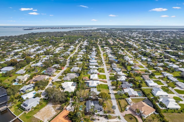 bird's eye view featuring a water view and a residential view