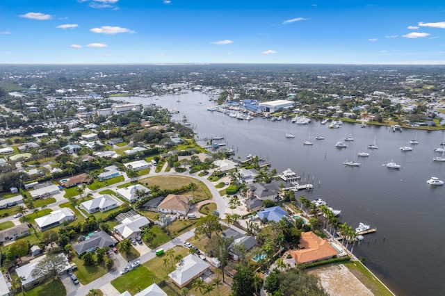 drone / aerial view with a water view and a residential view