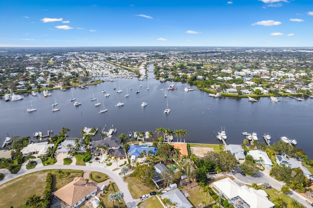 birds eye view of property featuring a water view and a residential view