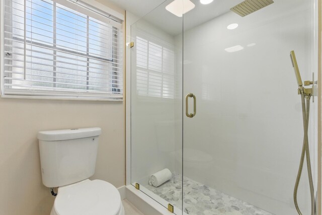 laundry area featuring independent washer and dryer and light hardwood / wood-style floors