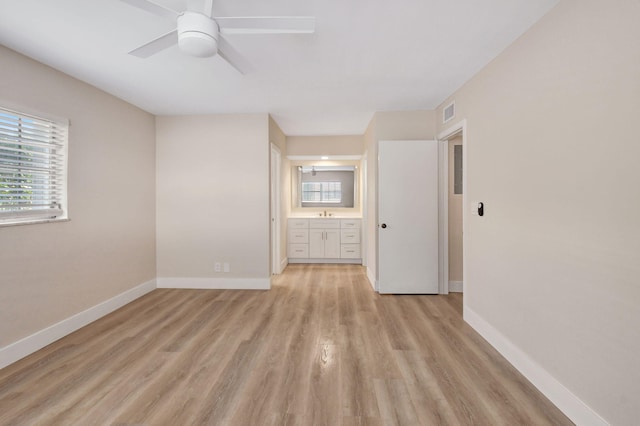 unfurnished room featuring light hardwood / wood-style floors and ceiling fan