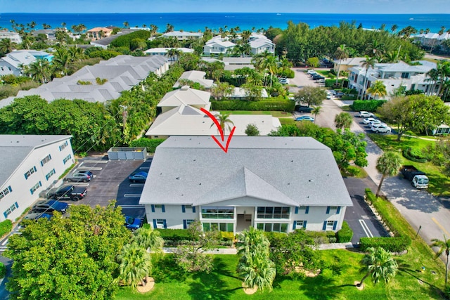 birds eye view of property with a residential view and a water view