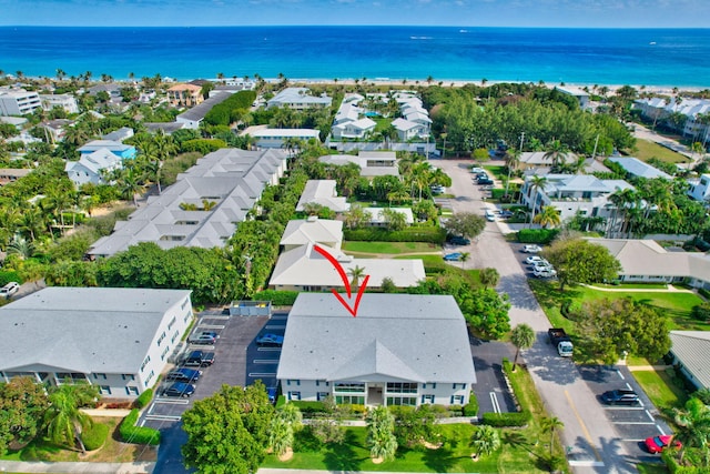 birds eye view of property featuring a water view and a residential view