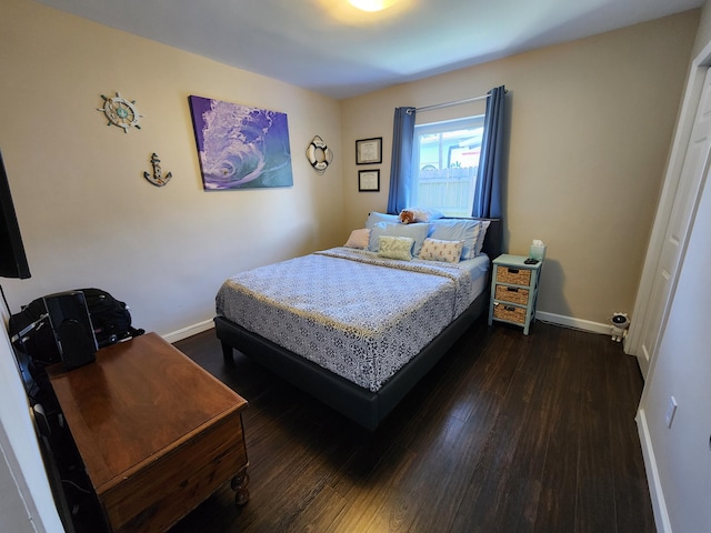 bedroom featuring dark hardwood / wood-style flooring