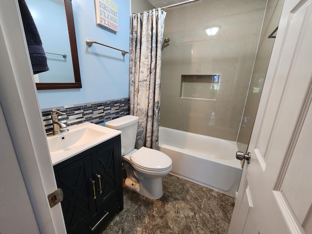 full bathroom featuring vanity, tile walls, shower / tub combo with curtain, and toilet