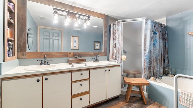 bathroom with independent shower and bath and vanity