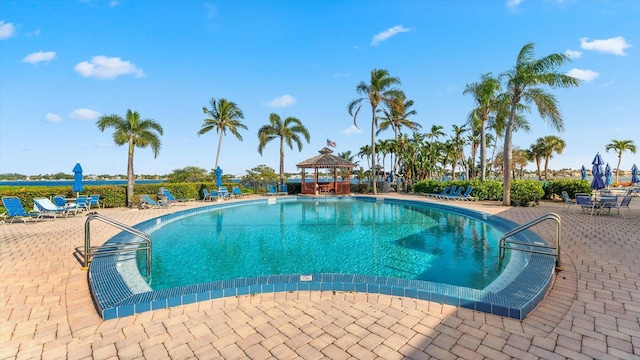 view of swimming pool with a gazebo and a patio area