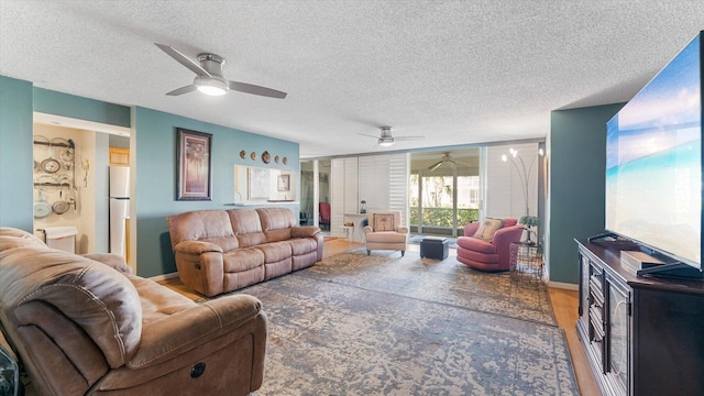 living room featuring wood-type flooring and a textured ceiling