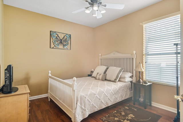 bedroom featuring dark wood-type flooring and ceiling fan