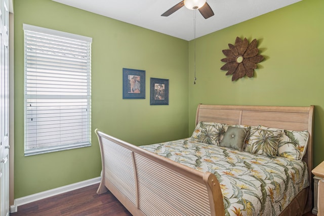 bedroom with dark wood-type flooring and ceiling fan