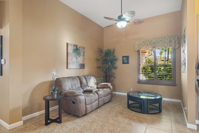 living room with light tile patterned floors and ceiling fan