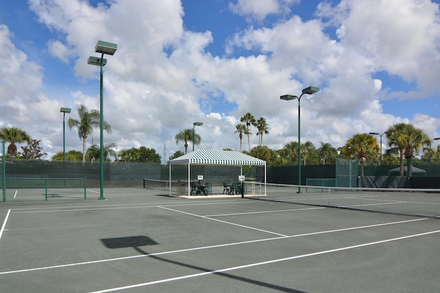 view of tennis court featuring a gazebo