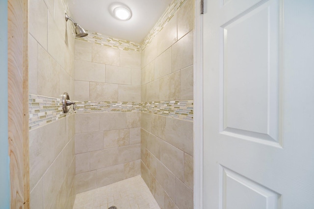 bathroom with tiled shower