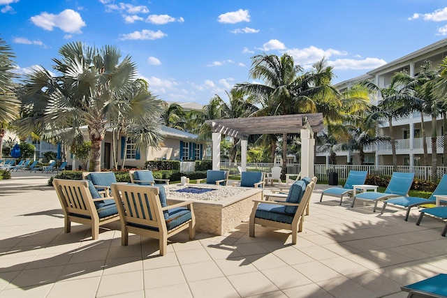 view of patio featuring a fire pit and a pergola