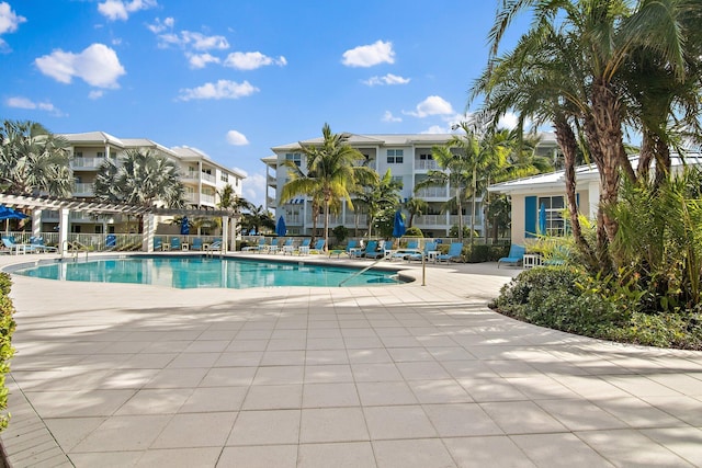 view of pool with a pergola and a patio area