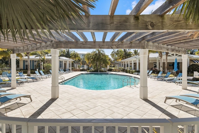 view of pool with a patio area and a pergola