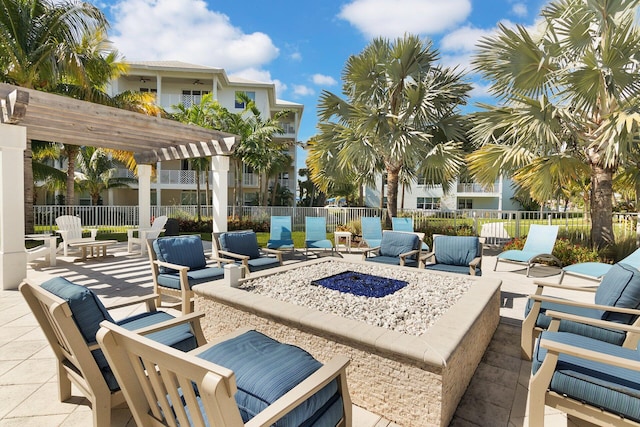 view of patio featuring an outdoor fire pit and a pergola