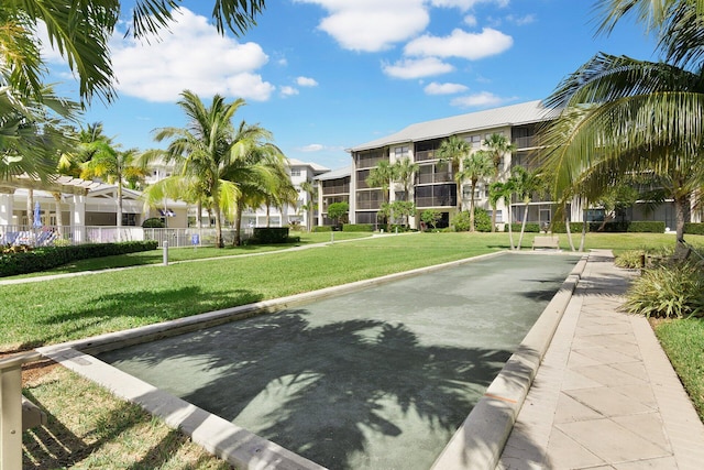 view of home's community featuring a yard