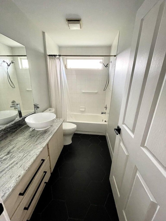 full bathroom with vanity, toilet, and shower / bath combo with shower curtain