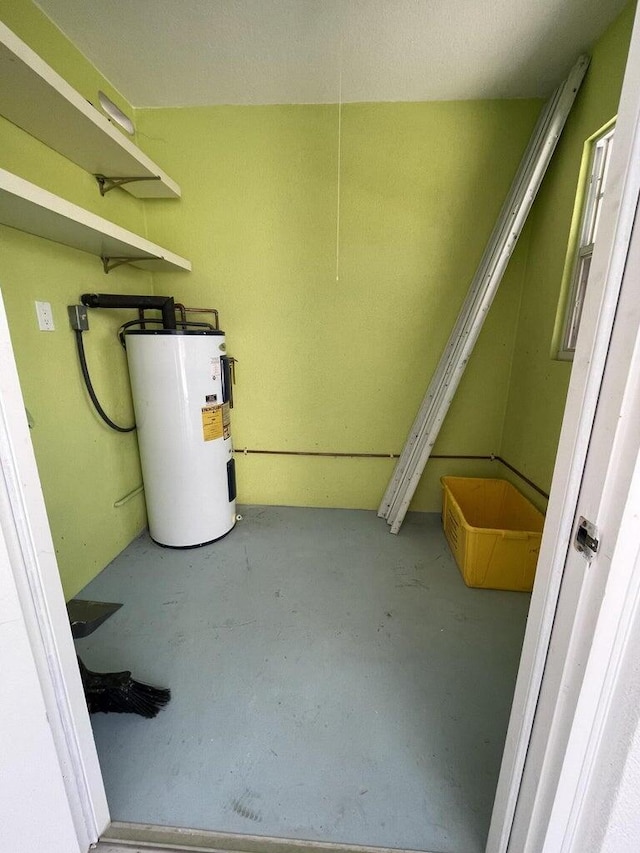 utility room with electric water heater