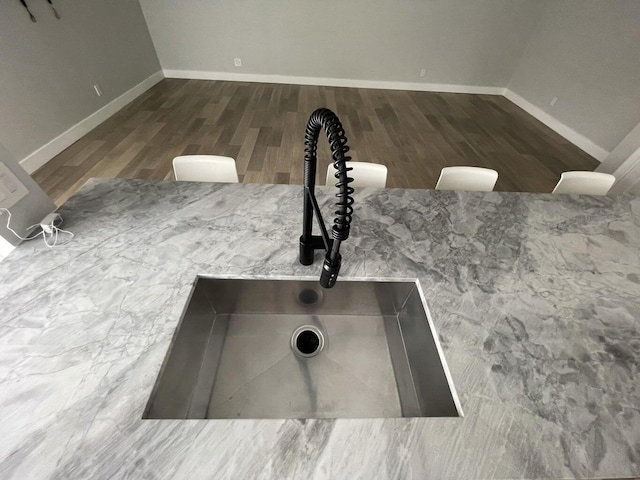 details featuring sink and hardwood / wood-style floors