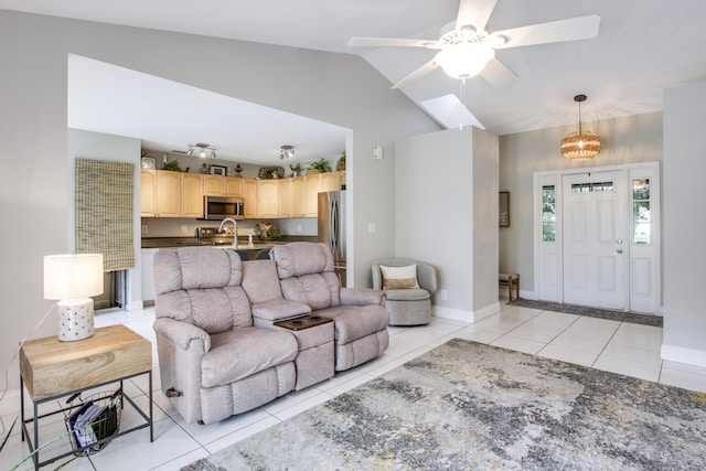 living room featuring light tile patterned flooring, ceiling fan, and vaulted ceiling