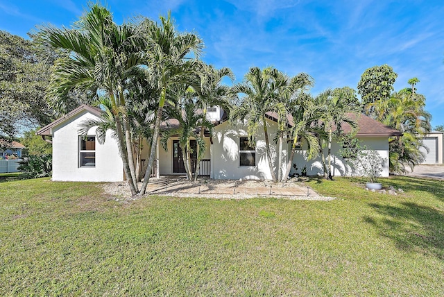 rear view of property with a yard