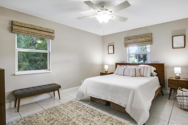 tiled bedroom with ceiling fan