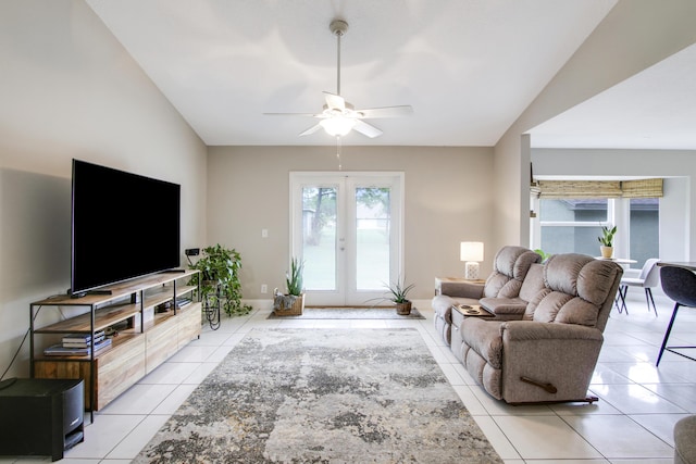 living room with lofted ceiling, light tile patterned floors, french doors, and ceiling fan