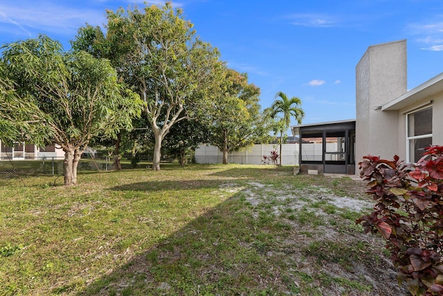 view of yard with a sunroom