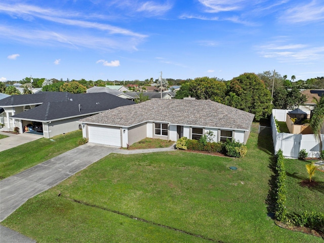 single story home featuring a garage and a front yard