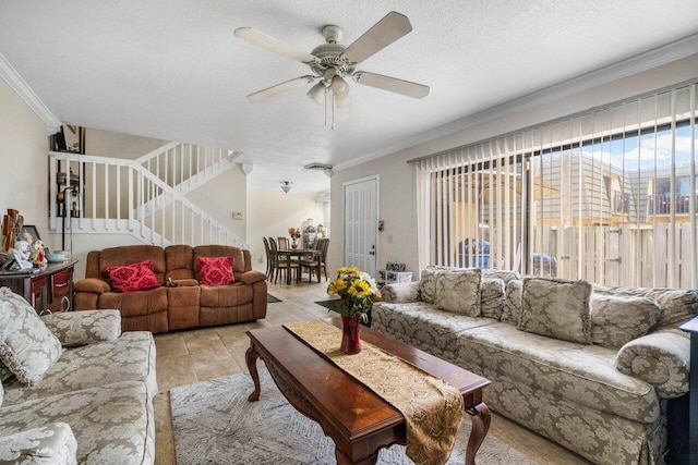tiled living room with crown molding, a textured ceiling, and ceiling fan