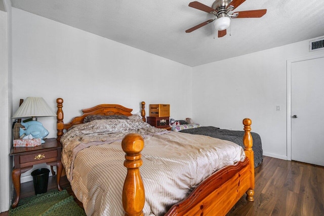 bedroom featuring ceiling fan and dark hardwood / wood-style flooring