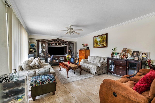 living room featuring crown molding, light tile patterned floors, and ceiling fan