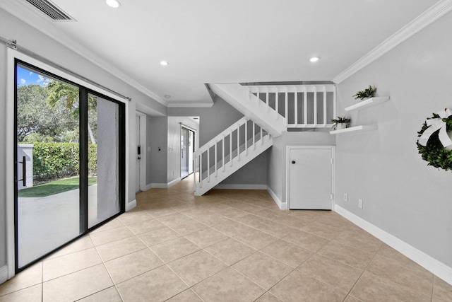 interior space featuring tile patterned flooring and ornamental molding