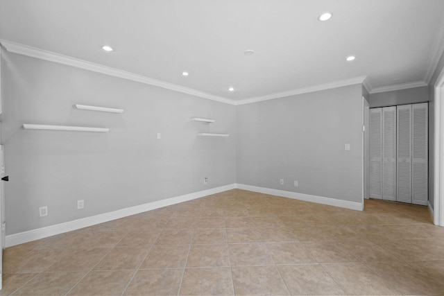 unfurnished room featuring crown molding and light tile patterned floors