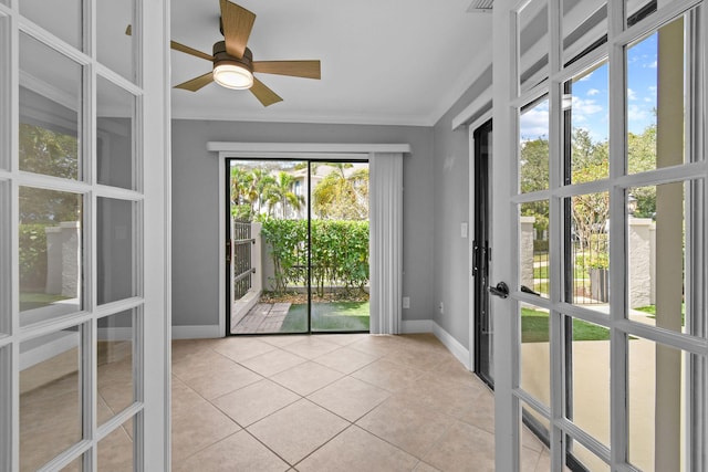 unfurnished sunroom with ceiling fan