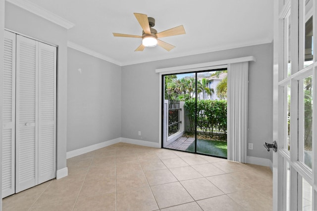 unfurnished bedroom featuring light tile patterned floors, ornamental molding, and access to exterior