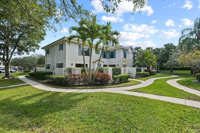 view of side of property with a yard