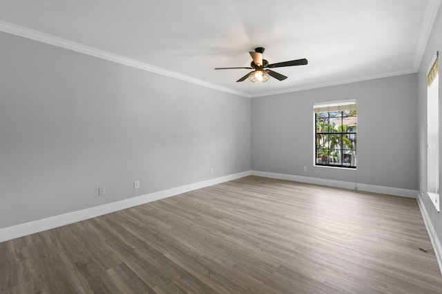 empty room with crown molding, ceiling fan, and light hardwood / wood-style flooring