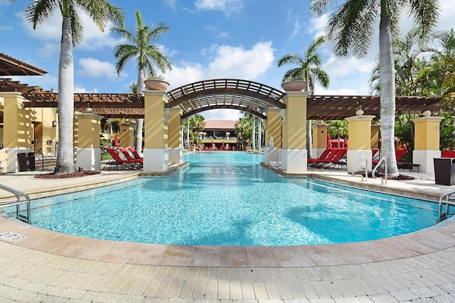 view of swimming pool with a pergola