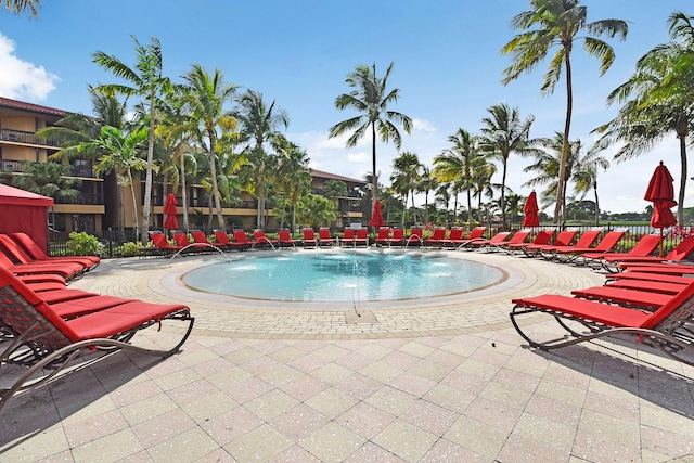 view of swimming pool with pool water feature