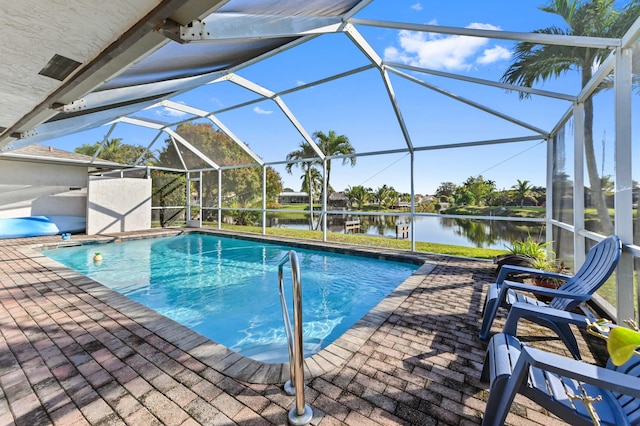 view of pool featuring a lanai, a patio area, and a water view