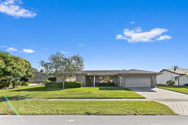 single story home with a garage and a front yard