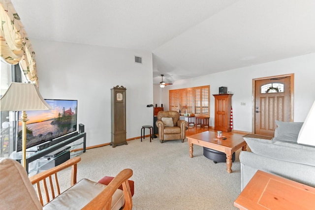 carpeted living room featuring ceiling fan and lofted ceiling